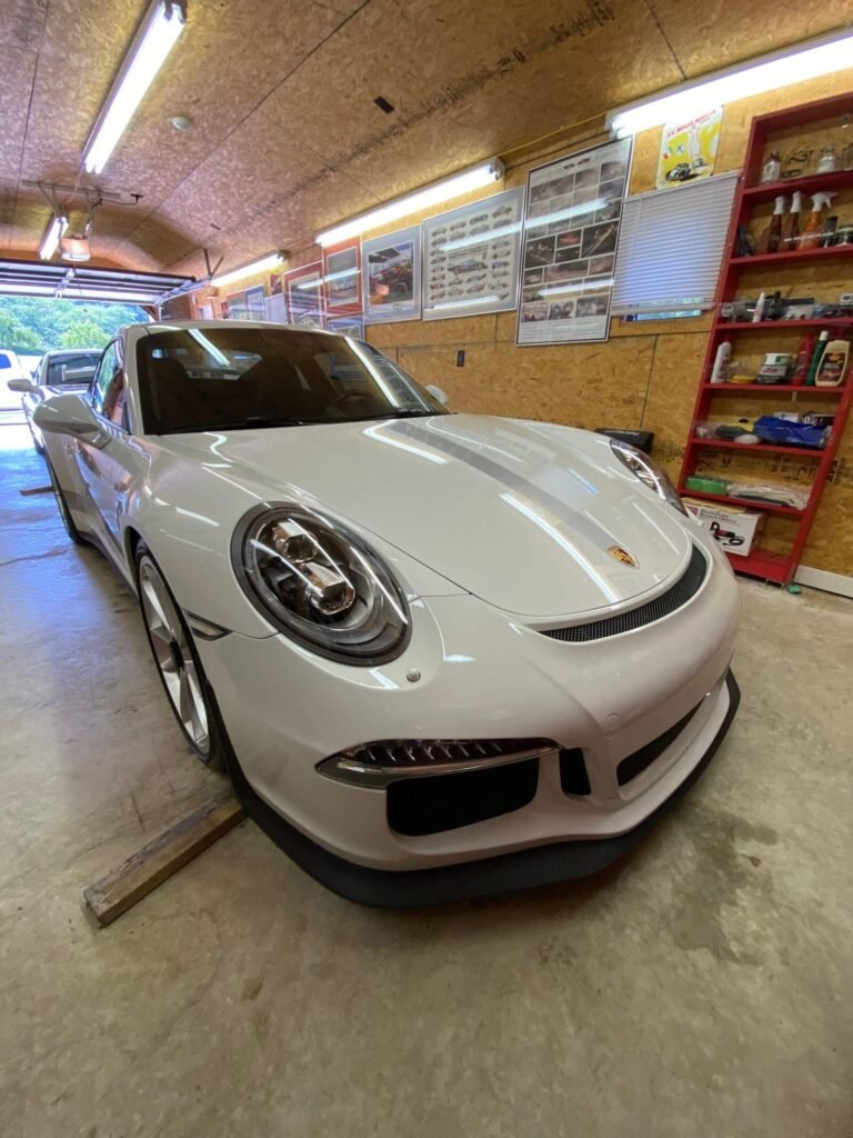 white porsche in garage